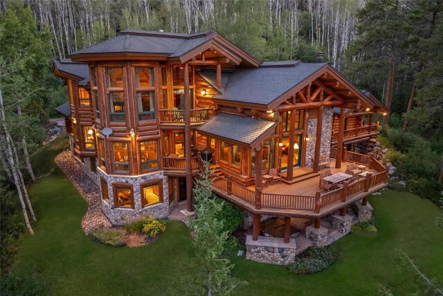 27800 Wapiti Way, Steamboat Springs, CO 80487 - rear view of property featuring a balcony, roof with shingles, a yard, and log siding