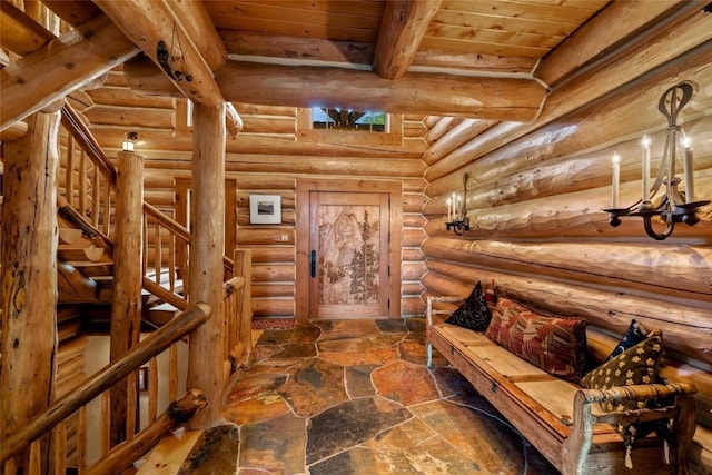 27800 Wapiti Way, Steamboat Springs, CO 80487 - sitting room featuring stairway, wooden ceiling with exposed beams, stone floors, and log walls