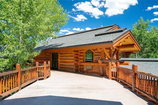 27800 Wapiti Way, Steamboat Springs, CO 80487 - back of house featuring log exterior and a shingled roof