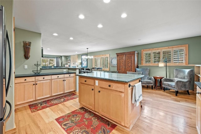 100 River Park Dr Unit 100A, Breckenridge, CO 80424 - kitchen with light brown cabinets, recessed lighting, light wood finished floors, healthy amount of natural light, and open floor plan