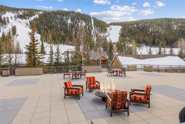 1211 W Keystone Rd Unit 2755, Keystone, CO 80435 - view of community featuring fence, a patio area, a fire pit, and a mountain view