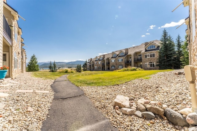 view of home's community featuring a mountain view and a residential view