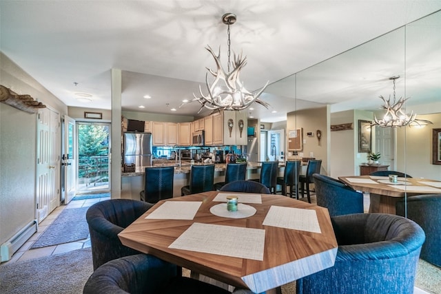dining space with baseboard heating, an inviting chandelier, recessed lighting, and light tile patterned floors