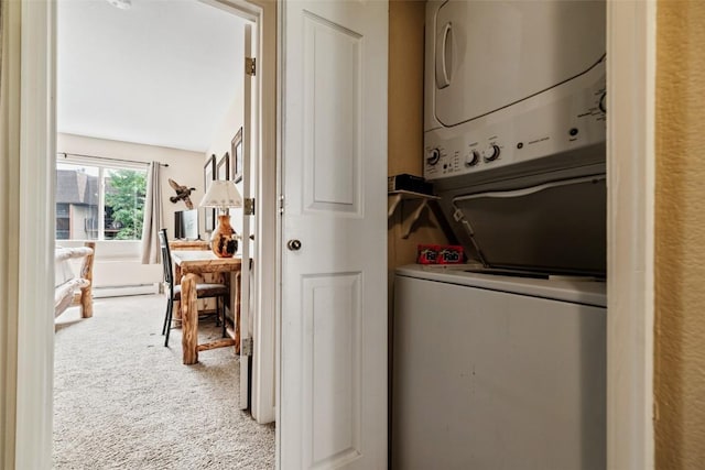 clothes washing area featuring stacked washer and dryer, carpet flooring, baseboard heating, and laundry area