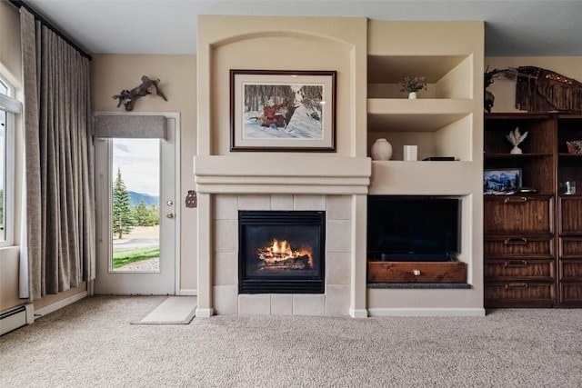 carpeted living room with a fireplace and baseboard heating