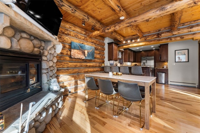 878 American Way, Breckenridge, CO 80424 - dining space featuring wood ceiling, rustic walls, beam ceiling, and light wood-style flooring