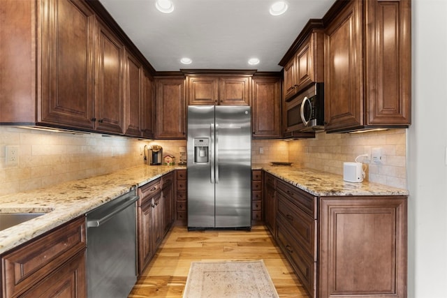 878 American Way, Breckenridge, CO 80424 - kitchen with recessed lighting, appliances with stainless steel finishes, light stone counters, and light wood-type flooring