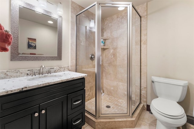 878 American Way, Breckenridge, CO 80424 - bathroom featuring toilet, vanity, tile patterned flooring, and a stall shower