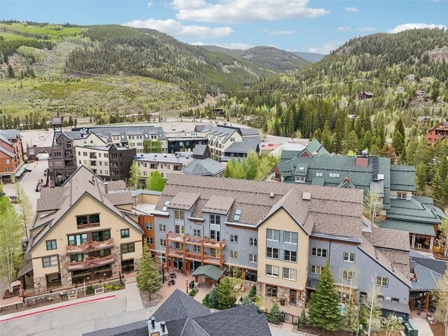 129 River Run Rd Unit 8055, Keystone, CO 80435 - aerial perspective of suburban area with mountains and a heavily wooded area