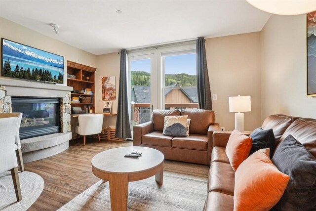 129 River Run Rd Unit 8055, Keystone, CO 80435 - living room with a fireplace and wood finished floors