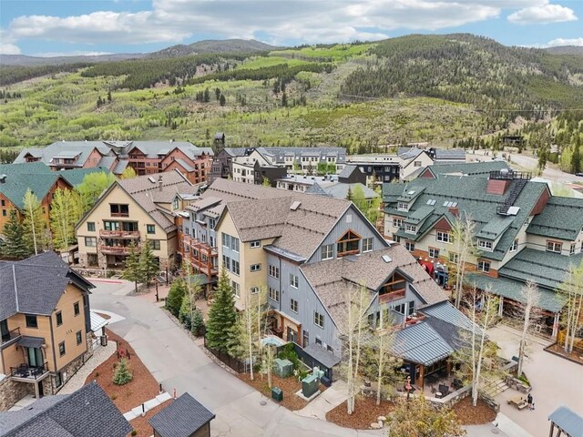 129 River Run Rd Unit 8055, Keystone, CO 80435 - aerial view of residential area featuring a heavily wooded area and a mountainous background