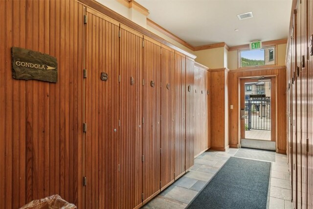 129 River Run Rd Unit 8055, Keystone, CO 80435 - hallway featuring crown molding and light stone finish flooring