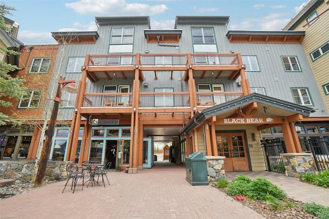 129 River Run Rd Unit 8055, Keystone, CO 80435 - rear view of house featuring a balcony, french doors, and board and batten siding