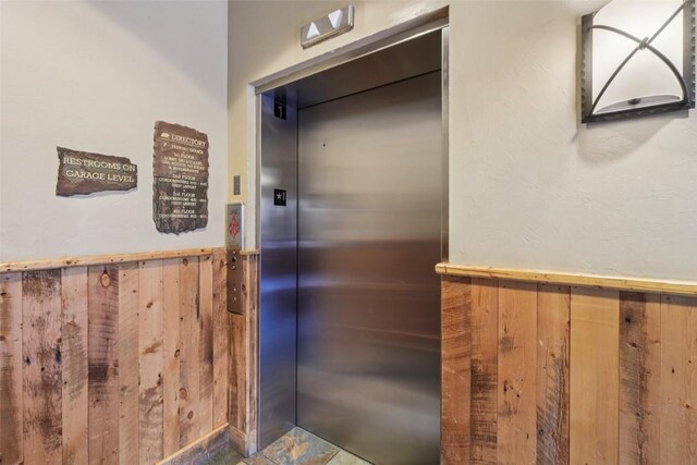 129 River Run Rd Unit 8055, Keystone, CO 80435 - elevator with wood walls and wainscoting