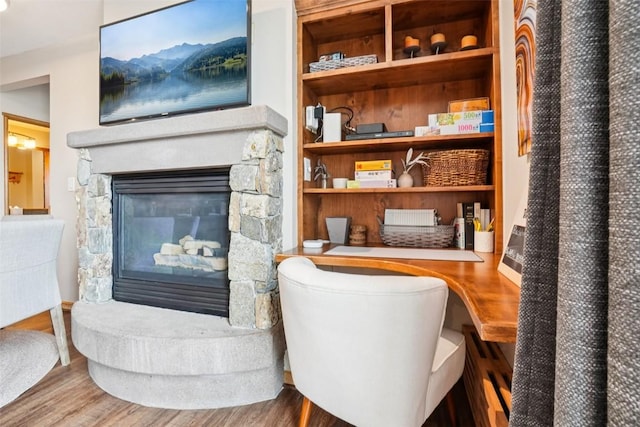 129 River Run Rd Unit 8055, Keystone, CO 80435 - living area with a stone fireplace and wood finished floors