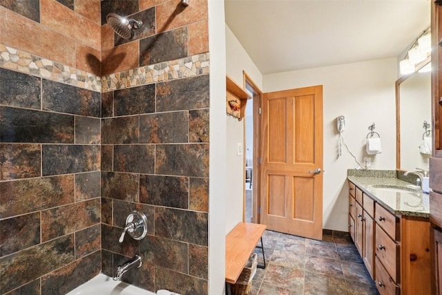 129 River Run Rd Unit 8055, Keystone, CO 80435 - bathroom featuring vanity, bathing tub / shower combination, and stone finish flooring