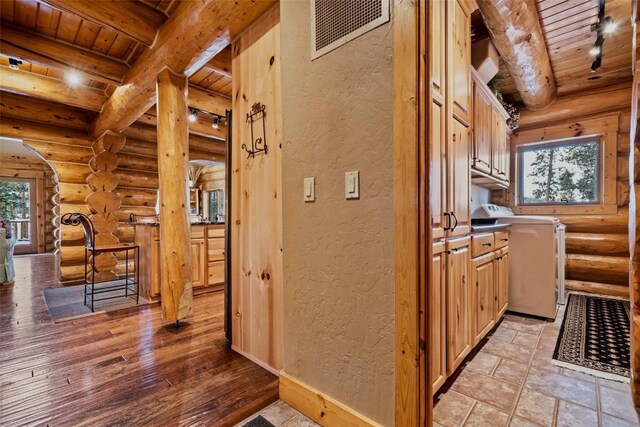 107 Primrose Pl, Frisco, CO 80443 - hallway featuring beamed ceiling, a textured wall, wooden ceiling, and visible vents