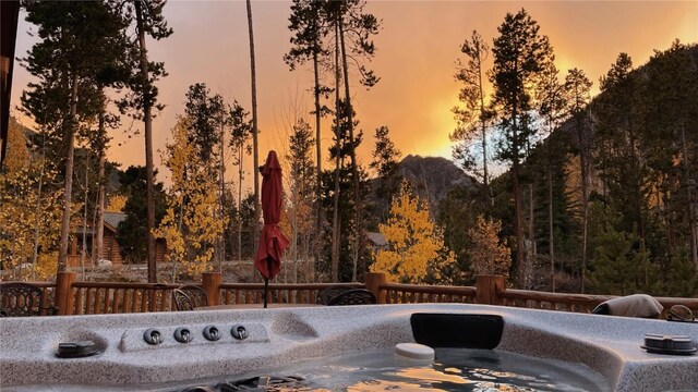 107 Primrose Pl, Frisco, CO 80443 - patio terrace at dusk with a hot tub