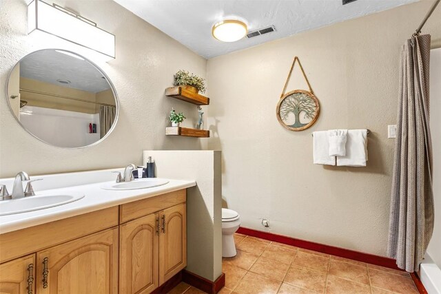 651 Lamb Mountain Rd, Fairplay, CO 80440 - full bathroom with double vanity, tile patterned floors, and a shower with shower curtain