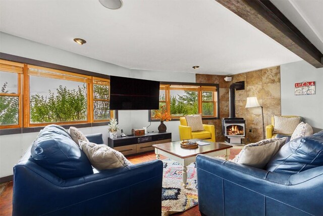 651 Lamb Mountain Rd, Fairplay, CO 80440 - living area with a wood stove, wood finished floors, and beamed ceiling