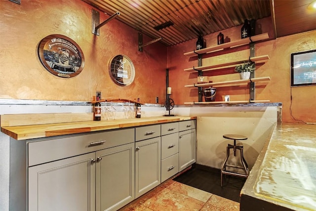 651 Lamb Mountain Rd, Fairplay, CO 80440 - bar with a textured wall and wooden ceiling