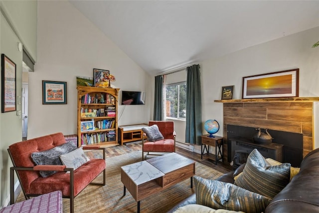 133 Woodchuck Ct, Silverthorne, CO 80498 - living room featuring wood finished floors, high vaulted ceiling, and a fireplace