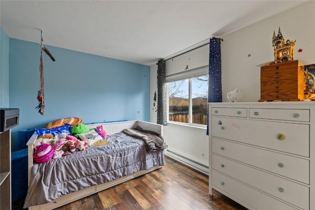 133 Woodchuck Ct, Silverthorne, CO 80498 - bedroom featuring baseboard heating and wood finished floors