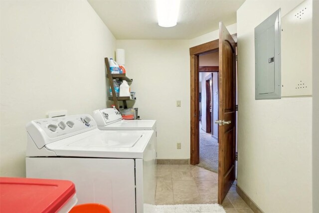0050 County Road 1293 Unit B, Silverthorne, CO 80498 - laundry room with laundry area, washer and clothes dryer, light tile patterned floors, electric panel, and baseboards