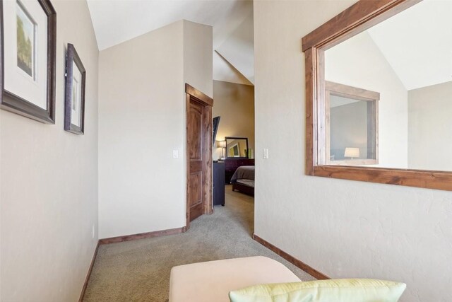 0050 County Road 1293 Unit B, Silverthorne, CO 80498 - corridor featuring lofted ceiling, carpet floors, and baseboards