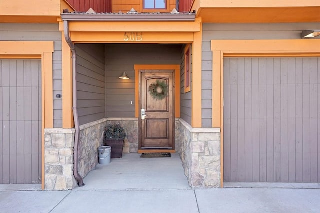 0050 County Road 1293 Unit B, Silverthorne, CO 80498 - doorway to property with stone siding and a garage