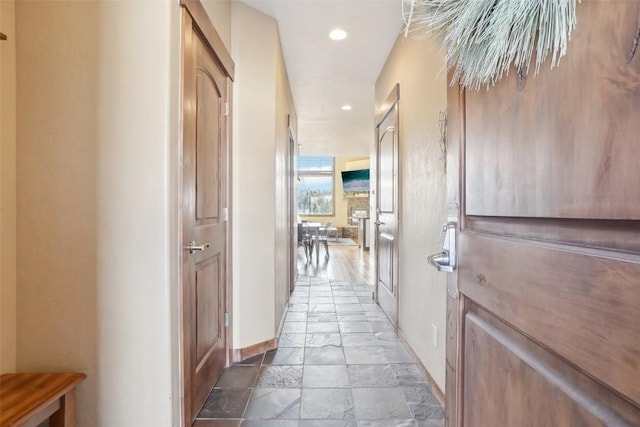 0050 County Road 1293 Unit B, Silverthorne, CO 80498 - hallway with recessed lighting, stone tile floors, and baseboards