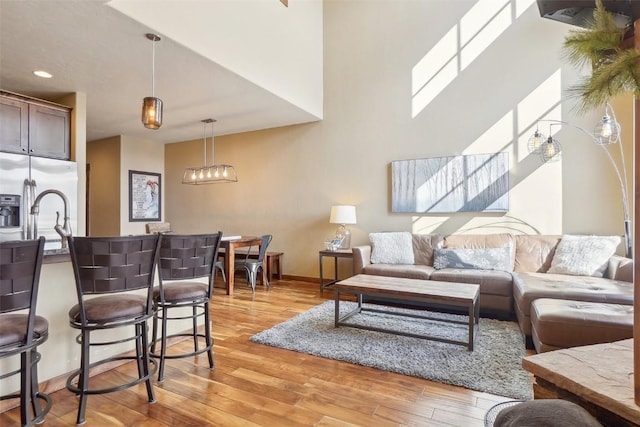 0050 County Road 1293 Unit B, Silverthorne, CO 80498 - living area with baseboards, light wood-style floors, and recessed lighting