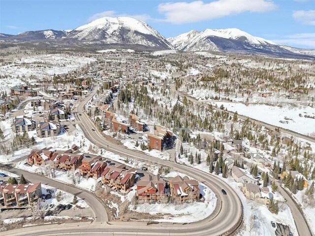 0050 County Road 1293 Unit B, Silverthorne, CO 80498 - snowy aerial view featuring a residential view and a mountain view