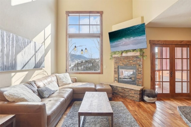 0050 County Road 1293 Unit B, Silverthorne, CO 80498 - living area with french doors, wood finished floors, and a fireplace