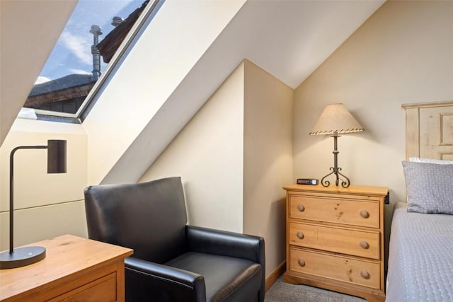 living area featuring vaulted ceiling and carpet