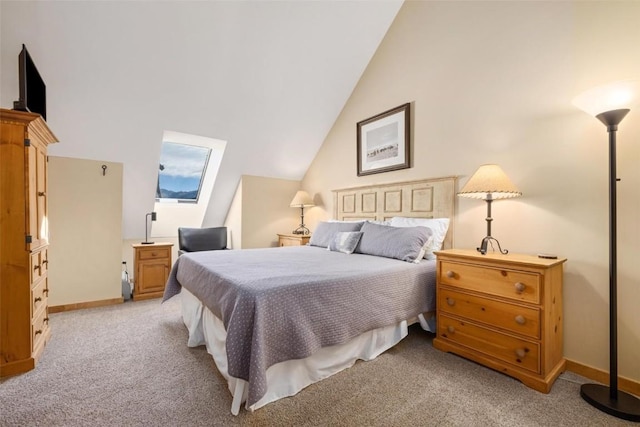 bedroom with light carpet, vaulted ceiling, and baseboards
