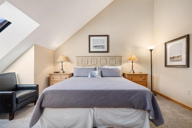 carpeted bedroom featuring lofted ceiling and baseboards
