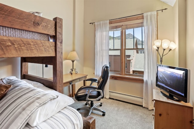 carpeted bedroom with a baseboard radiator