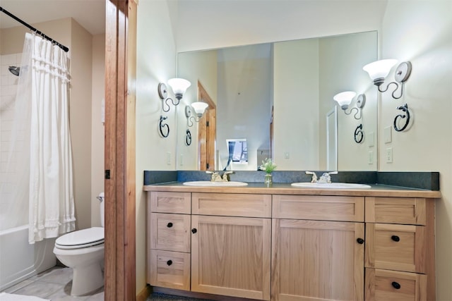 bathroom featuring shower / bath combination with curtain, toilet, a sink, and double vanity