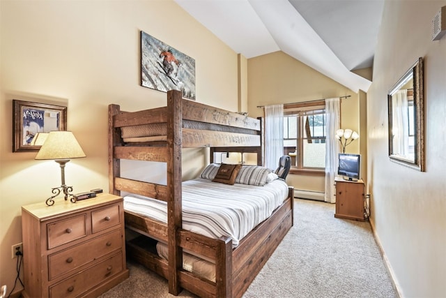 carpeted bedroom with a baseboard heating unit, vaulted ceiling, and baseboards