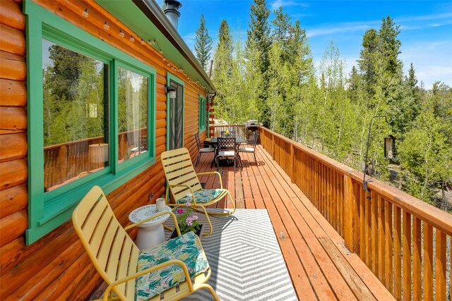 433 Fremont Knoll Ln, Jefferson, CO 80456 - wooden deck featuring outdoor dining area