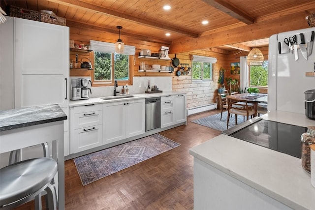 433 Fremont Knoll Ln, Jefferson, CO 80456 - kitchen with open shelves, a sink, a baseboard heating unit, wood walls, and white cabinetry