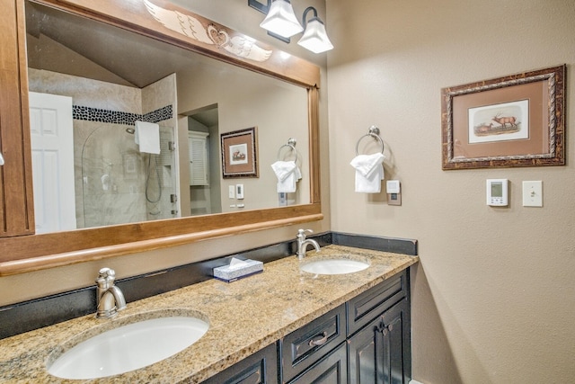 40 Fairway Ln Unit 31, Copper Mountain, CO 80443 - full bath with a stall shower, double vanity, a textured wall, and vaulted ceiling