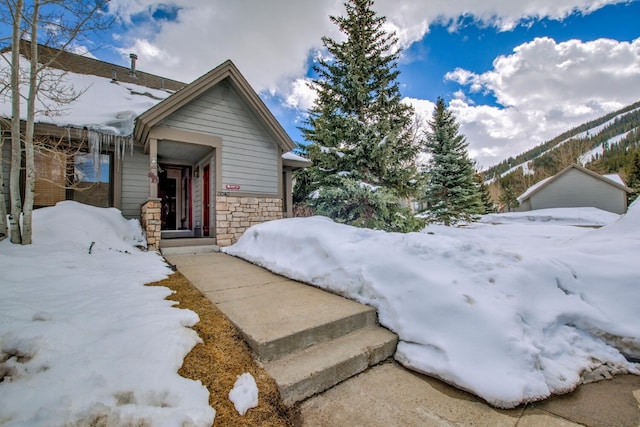 40 Fairway Ln Unit 31, Copper Mountain, CO 80443 - view of snowy exterior with stone siding