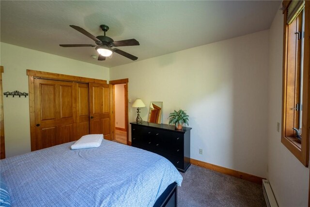 580 Anglers Dr Unit 204, Steamboat Springs, CO 80487 - carpeted bedroom with baseboards, baseboard heating, a ceiling fan, and a closet