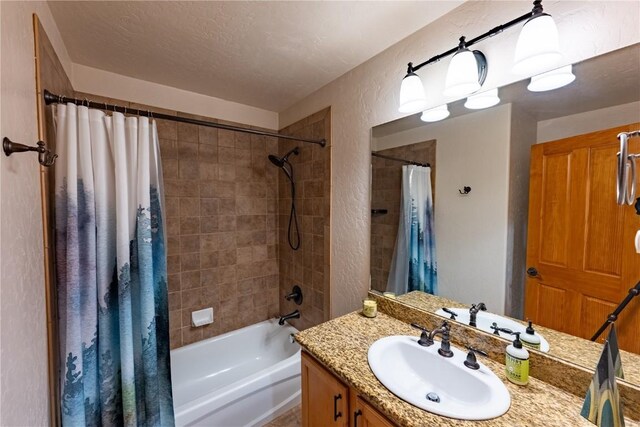 580 Anglers Dr Unit 204, Steamboat Springs, CO 80487 - bathroom featuring vanity, a textured wall, and shower / bathtub combination with curtain