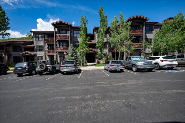 580 Anglers Dr Unit 204, Steamboat Springs, CO 80487 - view of building exterior with uncovered parking
