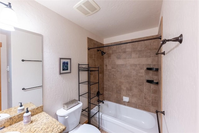 580 Anglers Dr Unit 204, Steamboat Springs, CO 80487 - bathroom with toilet,  shower combination, a textured wall, and vanity