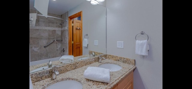 22714 US Highway 6 Unit 5989, Keystone, CO 80435 - bathroom with tiled shower / bath combo, a sink, and double vanity