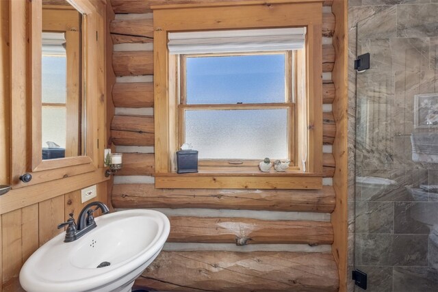 82 Potentilla Ln, Keystone, CO 80435 - full bathroom featuring rustic walls, a sink, and plenty of natural light